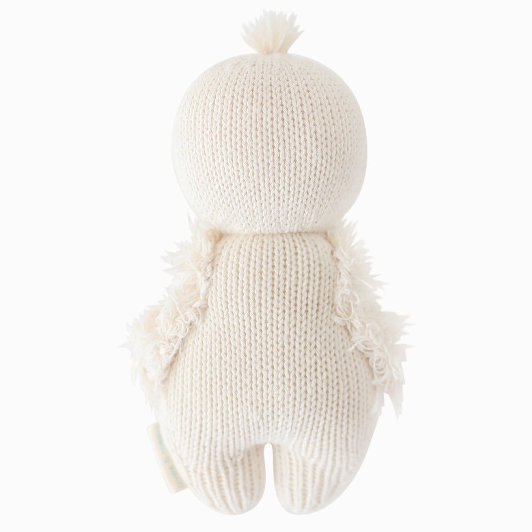 The baby gosling stuffed animal shown from the back.