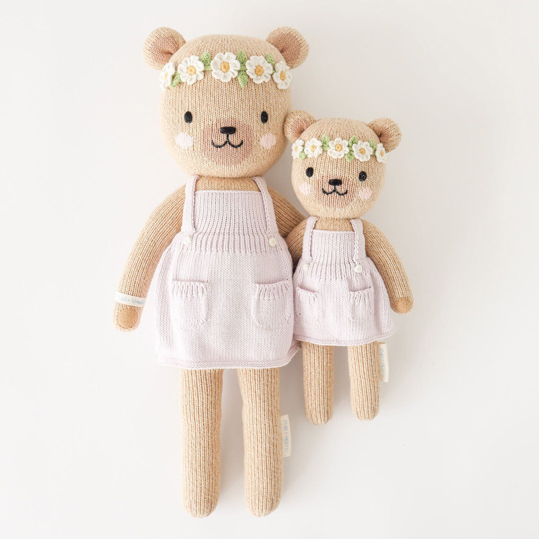 Regular and little Olivia the honey bear stuffed dolls with their arms around each other.