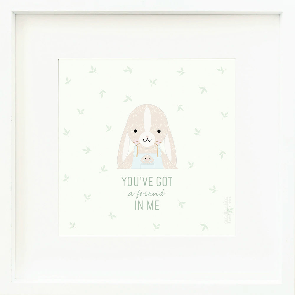 An inspirational print with a graphic of Briar the bunny on a white background with a green leaf print and the words “You’ve got a friend in me” in green text.