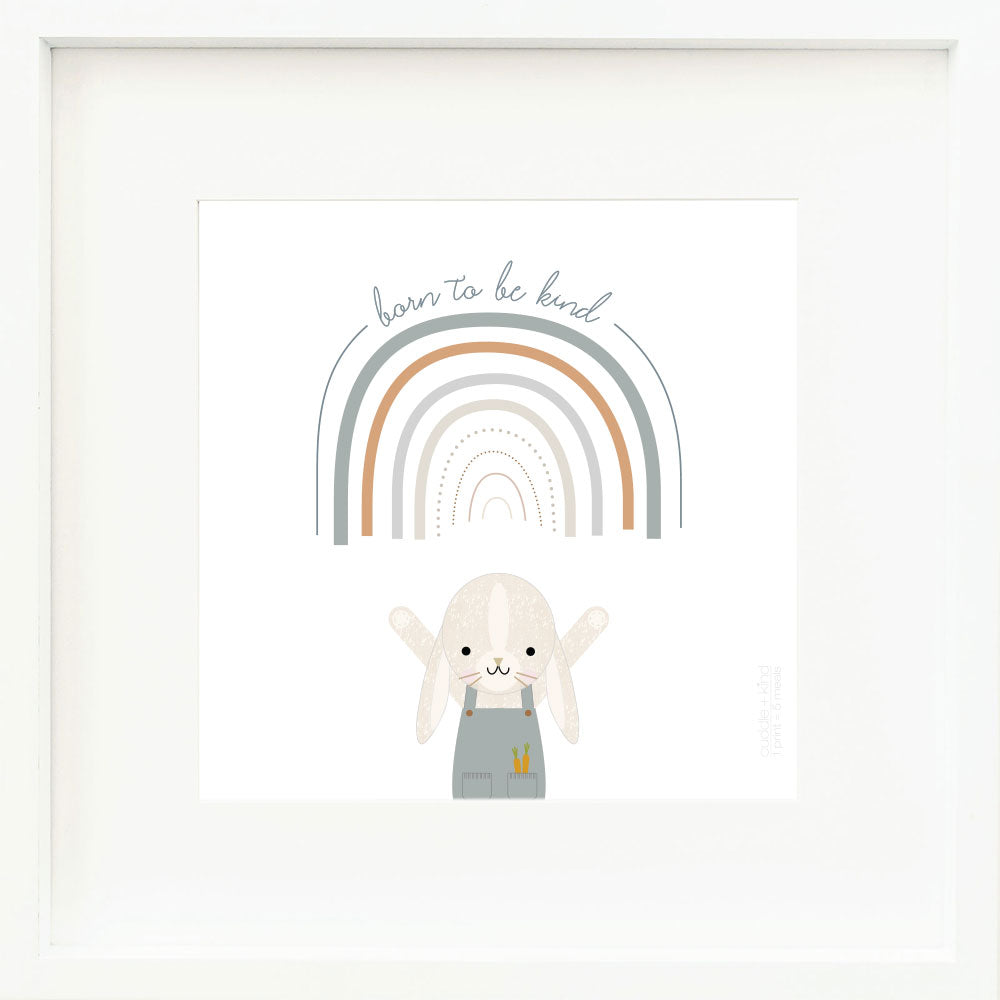 An inspirational print with a graphic of Henry the bunny with his arms in the air and the words “Born to be kind” in gray on a white background with a drawing of a rainbow.