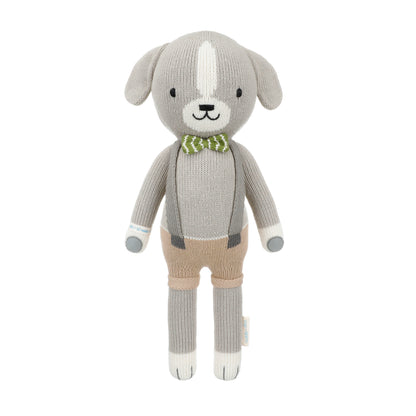 Noah the dog shown from 360°. Noah is wearing brown shorts, gray suspenders and a striped green and white bow tie.