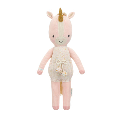 Ella the unicorn shown from 360°.  Ella is wearing a white romper with confetti polka dots and a pom-pom tie.