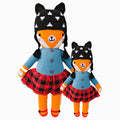 Sadie the fox in the regular and little sizes, shown from the front. Sadie has a black winter hat with white accents, a blue sweater and red plaid skirt.