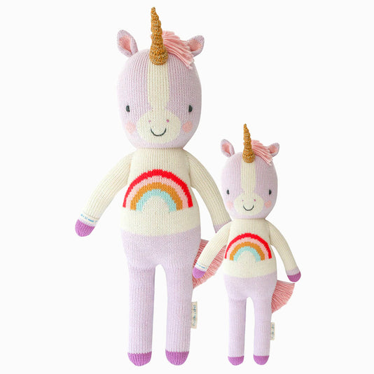 Zoe the unicorn in the regular and little sizes, shown from the front. Zoe is purple, and her shirt has a rainbow on it.