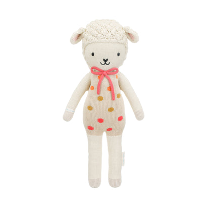 Lucy the lamb shown from 360°. Lucy’s outfit has pink, gold and orange polka dots. She has a bright pink bow.