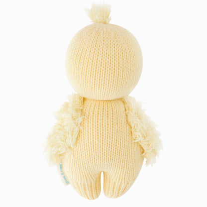 The baby duckling stuffed animal shown from the back.