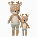 Elliott the fawn in the regular and little sizes, shown from the front. Elliott is wearing green shorts with a tie on the front.