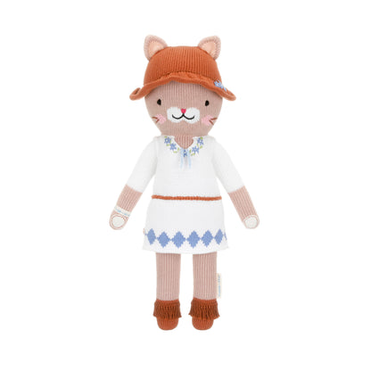 Chelsea the cat  shown from 360°. Chelsea is wearing a white dress with blue embroidered details, a brown hat and brown boots.