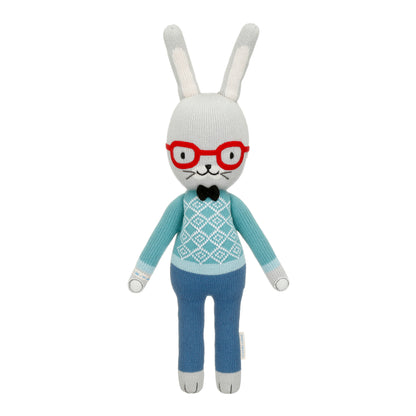 Benedict the bunny shown from 360°. Benedict is wearing red glasses, a blue sweater with a bow tie, and blue pants.