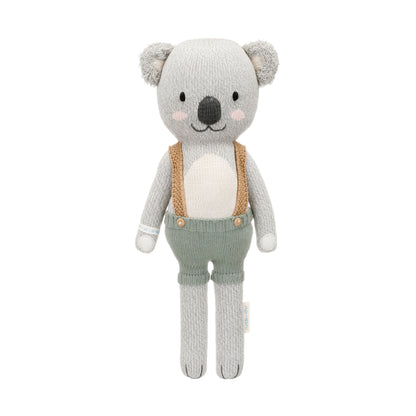Quinn the koala shown from 360°. Quinn is wearing green shorts with brown suspenders.