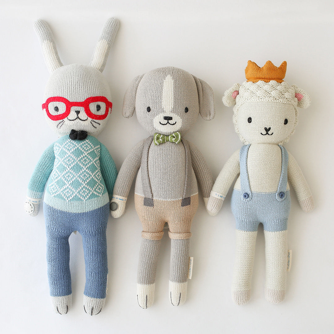 Three cuddle+kind hand-knit stuffed dolls: Benedict the bunny, Noah the dog and Sebastian the lamb. 