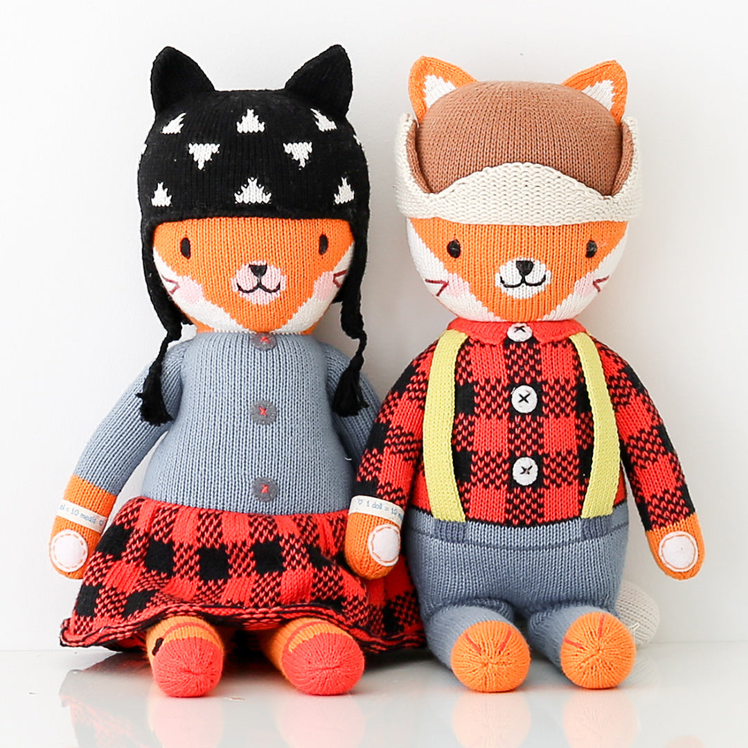 Sadie the fox and Wyatt the fox stuffed dolls sitting side-by-side.
