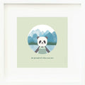 An inspirational print with a graphic of Paxton the panda in front of a mountainous landscape of blue watercolour. The background of the print is jade with the words “Be proud of who you are” in darker green.