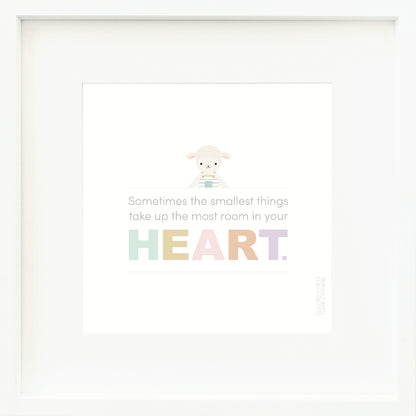 A framed print with a drawing of Avery the lamb and text that says “Sometimes the smallest things take up the most room in your heart.”