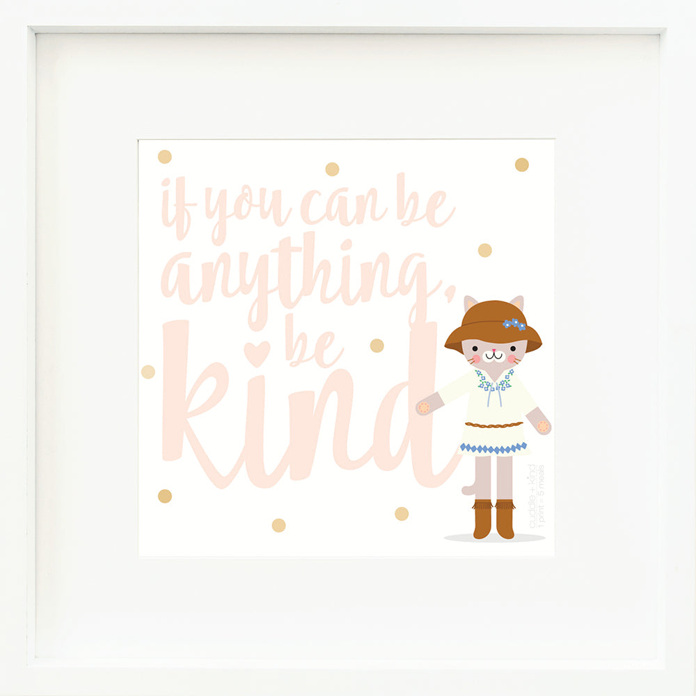 A framed print with a drawing of Chelsea the cat and text that says “If you can be anything, be kind.”