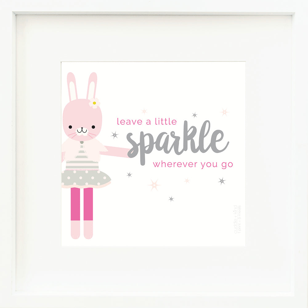 A framed print with a drawing of Chloe the bunny and text that says “Leave a little sparkle wherever you go.”