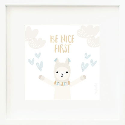 A framed print with a drawing of Lucas the llama and text that says “Be nice first.”