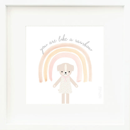 A framed print with a drawing of Mia the dog and text that says “You are like a rainbow.”