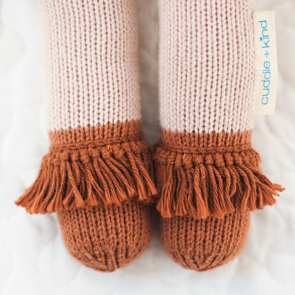 A close-up showing the hand-knit tassels on Chelsea the cat’s boots.