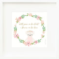 An inspirational print with a graphic of Charlotte the dog inside a ring of flowers on a white background with the words “With grace in her heart + flowers in her hair” in golden yellow.