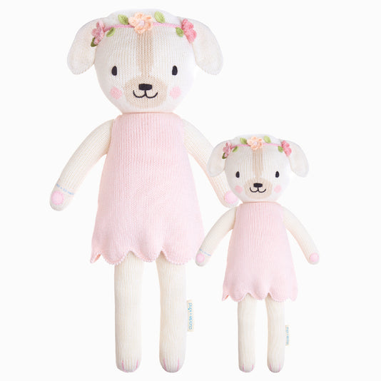 Charlotte the dog in the regular and little sizes, shown from the front. Charlotte is wearing a pink dress and an embroidered flower headband.