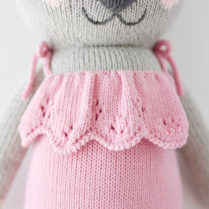 A close-up of Claire the koala’s, showing the hand-knit ruffled details on her romper.