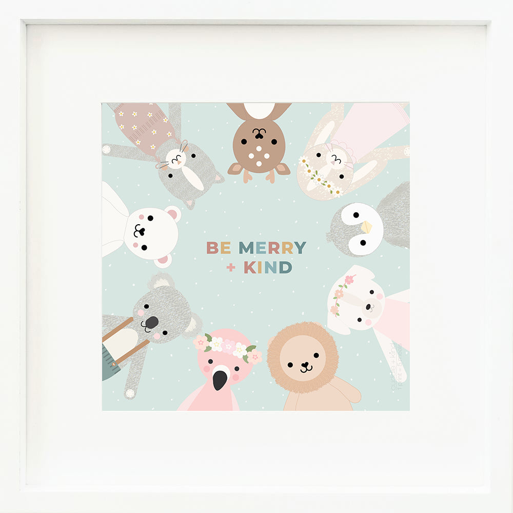 An inspirational print with the multicoloured words “Be merry + kind”. Graphics of cuddle and kind dolls appear in a circle around the text. The background of the print is blue and dotted with little white snowflakes.