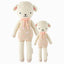 Lucy the lamb in the regular and little sizes, shown from the front. Lucy has a pastel pink outfit with polka dots and a pastel pink yarn bow.