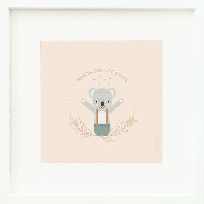 A framed print with a drawing of Quinn the koala and text that says “Reach for the stars.”