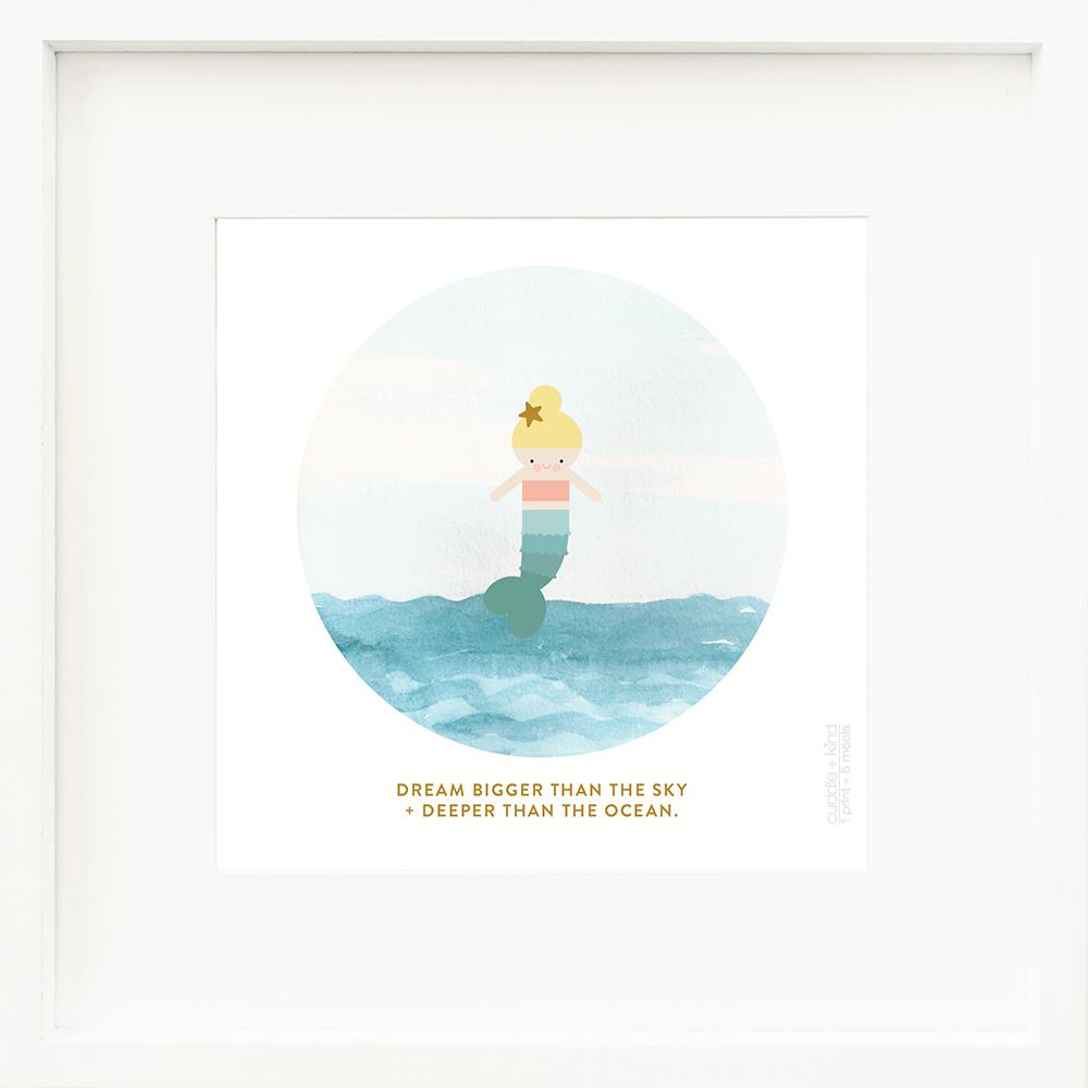 An inspirational print with a graphic of Skye the mermaid with an ocean and sky and the words “Dream bigger than the sky + deeper than the ocean” in dark yellow.