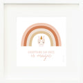 An inspirational print with a graphic of Zara the unicorn on a white background with an orange and pink rainbow and the words “Everything she does is magic” in pink.
